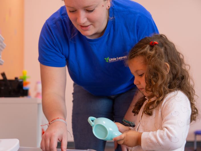 Teacher and students playing